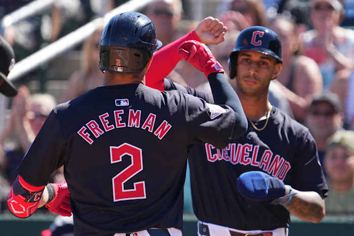 Mar 2, 2024; Goodyear, Arizona, USA; Cleveland Guardians third baseman Tyler Freeman (2) celebrates with Cleveland Guardians shortstop Brayan Rocchio (4) after hitting a home run against the Kansas City Royals during the first inning at Goodyear Ballpark. Mandatory Credit: Joe Camporeale-USA TODAY Sports